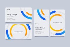 three business cards with different colors and shapes on the front, back and side of each card