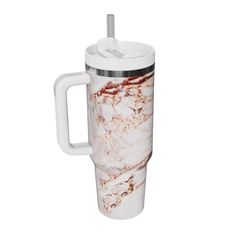 a white and brown marbled coffee mug with a straw in the cup holder, on a white background