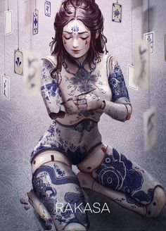 a woman with tattoos on her body sitting in the middle of a room filled with cards