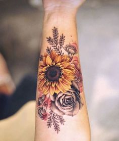 a sunflower and roses tattoo on the wrist