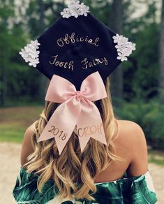 a woman wearing a graduation cap with flowers on it