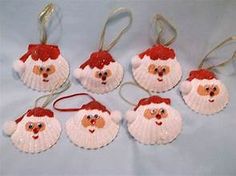 six christmas ornaments with santa's face on them