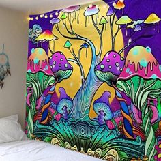 a colorful wall hanging over a bed in a bedroom