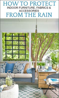 an outdoor furniture patio with blue and white pillows on the couch, in front of a tree