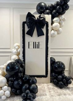 black and white balloons in the shape of a frame