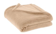 a tan blanket folded on top of each other