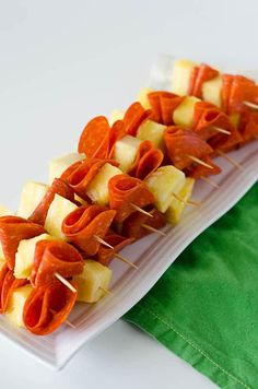 a white plate topped with fruit and veggies