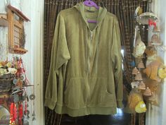 ♥ Designed by LANE BRYANT - from the late 90's.  ♥ 80% Cotton / 20% Polyester - nice and soft. ♥ Shaded olive green.  ♥ Fully zipper closure. ♥ LANE BRYANT's original key as zipper pull. ♥ Straight long sleeves. ♥ Patched elbows. ♥ 2 front pockets. * Please study the pictures AND measurements to get the best description.* ✂ Here are the measurements: underarm to underarm: 28". Length (shoulder to hem): 30". Sleeves: 25.". Original size tag: 26/28.  All my items come from a smoke free home  Postage includes tracking and delivery confirmation Thanks for looking (: Olive Green Hoodie, Green Hoodie, Late 90s, Elbow Patches, Zipper Pulls, Lane Bryant, Sweater Jacket, Size Tag, Olive Green