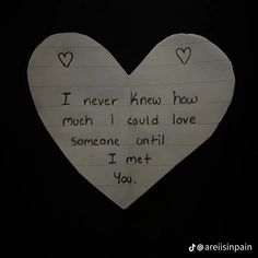 a paper heart with writing on it that says i never knew how much i could love someone until i met you