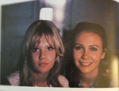 two women are posing for the camera in front of a mirror with their heads close together