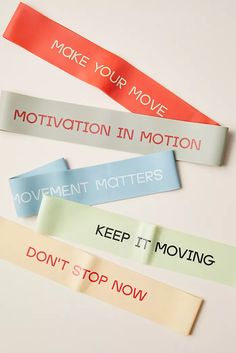 four different colored labels with the words move your move, motivation in motion, keep it moving and don't stop now