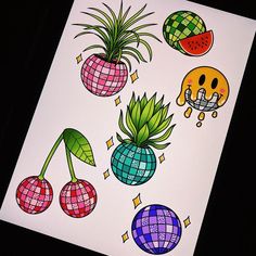 an art piece with different designs on it, including pineapples and watermelon