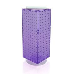 a purple plastic object with holes on the front and sides, against a white background