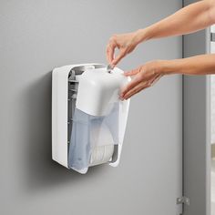 This Tork OptiServe coreless white double roll toilet tissue dispenser creates a clean and comfortable experience for your customers when using your high-traffic commercial restroom. The transparent white design makes it easy to see when it's time to refill, helping your staff to be more efficient and saving them time and effort. For your convenience, it's compatible with Tork 472880, 472887, and other Tork T7 and T5 refill items (all sold separately), which holds twice as much toilet tissue as conventional toilet paper rolls. The easy-to-find tail eliminates the need to reach inside the dispenser, allowing you to maintain a sanitary and hygienic restroom experience for your guests.   Its compact, vertical design saves you space and is perfect for smaller, high-traffic restrooms. This disp Commercial Restroom, Commercial Toilet, Tissue Dispenser, Toilet Paper Rolls, Toilet Tissue, Vertical Design, Paper Rolls, Toilet Paper Roll, White Design