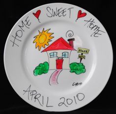 a white plate with a drawing of a house and the words home sweet home on it