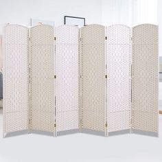 a room divider with four panels in it