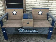 a bench made out of pallet wood with stars painted on the back and sides