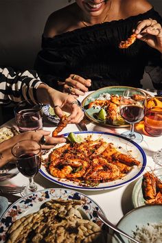 a group of people sitting around a table eating food