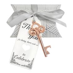 a key is tied to a gift card with a bow on the front and an i love you tag in the back