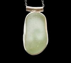 Individually handmade sterling silver pendant with a beautifully smooth seaglass nugget in seafoam green. The glass is sourced in Kintyre on the west coast of Scotland.  The naturally tumbled sea glass is set in a fine silver bezel and sits on a hand-sawn open backed sterling silver backplate with wave design, allowing the light to shine through. The pendant is suspended by a tube bail on a delicate sterling silver chain - please select your preferred length at checkout.  Other similar items available: * Pendants https://etsy.me/48jz6JC * Rings https://etsy.me/49nLolF * Bangles & bracelets https://etsy.me/4bKLOnt * Earrings https://etsy.me/4bMHZ14 * Other bits & bobs! https://etsy.me/4bNSFww Green Jewellery, Wave Pendant, Best Friend Birthday Gift, Sea Glass Ring, Friend Birthday Gift, Silver Sea, Anniversary Gift For Wife, Bangles Bracelets, Green Jewelry