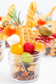 two glass jars filled with different types of snacks