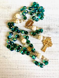 This lovely Rosary is created with 8mm faceted AB Swarovski 5000 round crystal beads that are of a luscious, green-teal color. The Pater's are AAA round white freshwater pearls in a generous 10 - 11mm size. . The soft and delicate colored Rosary is beautiful in its sheer simplicity, surely to be appreciated during your spiritual contemplation on the Gospels as you hold each soft bead.  Each crystal bead is now RARE and hard to find as Swarovski is no longer producing its beautiful crystals for retail sale.  Soon this rosary and any rosary of Swarovski crystals will be collector  items. . . . soon to become a cherished heirloom through the years. A lovely gift for yourself or someone you love . . . for any special and/or religious occasion or simply as a gift of your love. A Rosary to be en The Gospels, Beautiful Crystals, Holy Rosary, Catholic Rosary, Handmade Lampwork Bead, Rosary Catholic, Swarovski Crystal Beads, Celtic Cross, White Freshwater Pearl