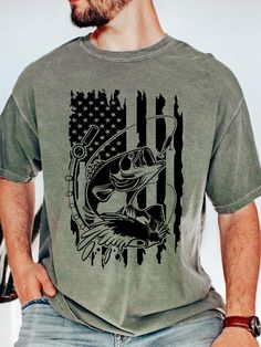 Bass Fishing T-Shirts Unisex Shirts-Plus Size T-Shirts. Brand of Shirt is Comfort Colors. Color of Shirt is Pepper (more like charcoal) Moss. Printing process is Direct to Garment aka DTG. All shirt are made to order. Please double check sizing before placing your order. 100% Ringspun Cotton. Classic fit. Unisex sizing, so it fits more loose than women sizing. Sizes: S, M, L, XL, 2XL, 3XL , 4XL Size chart is in photos for reference. Care Instructions. Wash inside out on a gentle cycle in cold water.  Hang to dry or tumble dry on a low heat setting. DO NOT Dry Clean or use bleach. Shipping. We offer Free Shipping in about 1-3 business days after you place the order. If you need it sooner, please let me know and I will do my best to get it to you sooner! Questions. Please let me know if you Pre-shrunk Short Sleeve Fishing Shirt, Short Sleeve Fish Print T-shirt For Fishing, Graphic Print Short Sleeve T-shirt For Fishing, Graphic Tee T-shirt For Fishing, Graphic Tee Short Sleeve T-shirt For Fishing, Fish Print Crew Neck Top For Fishing, Cotton Tops With Fish Print For Fishing, Fish Shirt, Bass Fish