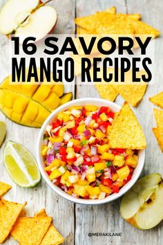 a white bowl filled with mango salsa and tortilla chips on top of a wooden table