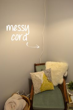 a room with a chair and a neon sign on the wall that says messy cord