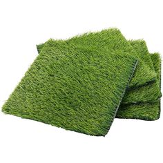 three pieces of green grass laid on top of each other