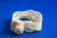 a close up of a white rope on a blue surface