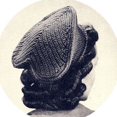 an old photo of a woman wearing a knitted hat with braids on her hair