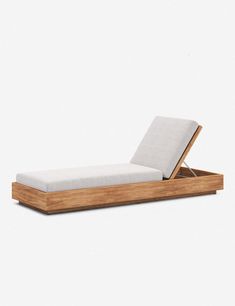 a bed that is made out of wood and has a mattress on top of it