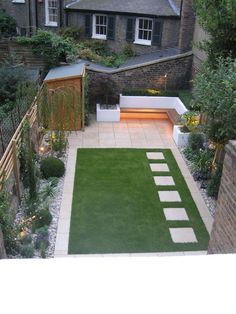 This contemporary garden in Canonbury, North London is simple and child  friendly. The idea to use cobbles as a weed suppressant makes gardening  very low maintenance. Small Back Gardens, Simple Garden Designs, Contemporary Garden Design, Back Garden Design, Modern Garden Design, Landscape Designs, Contemporary Garden, Low Maintenance Garden, Outdoor Gardens Design