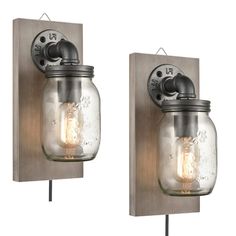 two mason jar wall sconces with one light on each side and the other turned on