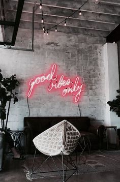 a neon sign that says goodbye on the wall