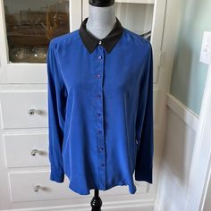 Beautiful $325 Equipment Femme France 100% Silk Shirt L Royal Blue With Black Collar. The Shirt Is Brand New, But It Does Have A Couple Of Marks From Shopwear That I Was Going To Have Dry Cleaned Out After I Purchased This, But Never Ended Up Doing. Blue Really Isn’t My Color. I Just Thought The Shirt Was So Beautiful. Because Of The Issues I Am Listing. This Is A Very Low Price, But I’m Open To Reasonable Offers. Check Out My Closet To Bundle And Save Even More. I’m Really Great Items. Play Flat This Shirt Measures 21 1/2 Inches From Armpit To Armpit, Total Length Down The Center Back Is 29 Inches Chic Blue Blouse With Spread Collar, Workwear Top With Contrast Collar, Chic Blue Workwear Shirt, Chic Blue Shirt For Workwear, Chic Blue Shirt For Work, Workwear Shirt With Contrast Collar, Blue Spread Collar Top For Work, Blue Collared Tops With Contrast Collar, Black Top With Contrast Collar For Work