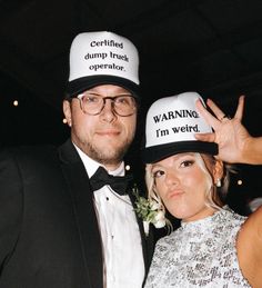 a man and woman wearing hats that say warning i'm weird