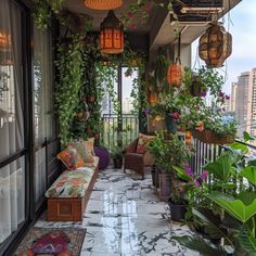 a balcony with lots of plants and potted plants on the balconied area