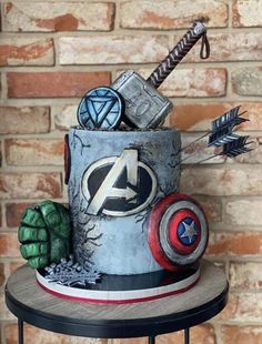 the avengers cake is made to look like it's coming out of an iron can