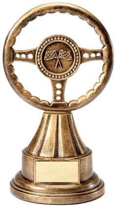 a gold trophy with a steering wheel on it