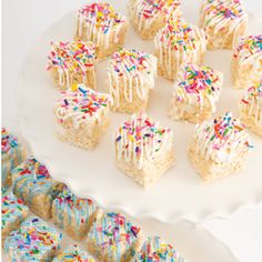 a white plate topped with lots of cake bites covered in sprinkles