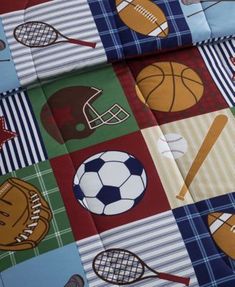 a bed with sports themed sheets on it