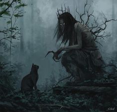 a woman kneeling down next to a cat in the forest