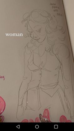 an image of a woman drawing on a piece of paper with the words women in it