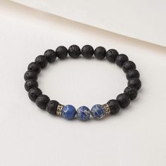 Benefits The Blue Regalite Himalayan Stone Bracelet includes both Lava Stone beads and Blue Regalite beads. Blue Regalite is a grounding, strengthening stone that promotes stability, clarity, and inner-peace, making it ideal for encouraging compassion, contentment, and tranquility. The lava stone also known as “basalt” is a porous volcanic rock that has been solidified from molten lava after conditions of intense heat and pressure. Materials We carefully design, test and ensure the quality of ou Spiritual Lava Stone Stretch Bracelet With Natural Stones, Holistic Blue Beaded Bracelets, Holistic Blue Beaded Bracelets For Meditation, Adjustable Sodalite Beaded Bracelets With 8mm Beads, Sodalite Round Beads Bracelets For Healing, Healing Lapis Lazuli Beaded Bracelets With Natural Stones, Meditation Bracelets With Natural Lava Stones, Lapis Lazuli Round Beads Bracelets For Meditation, Spiritual Lapis Lazuli Beaded Bracelet With Natural Stones