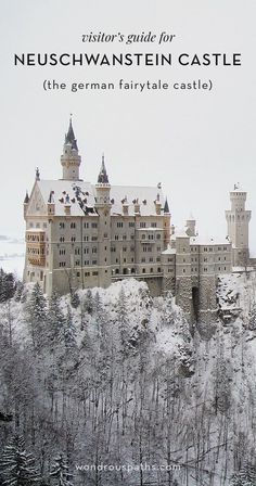 an old castle sits on top of a hill with trees in the foreground and snow covered ground below