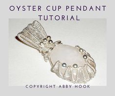 a close up of a brooch on a white background with the words oyster cup pendant