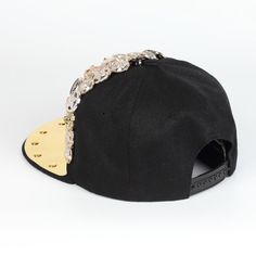 a black hat with gold chains on it