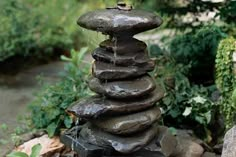 a stack of rocks with water running down them